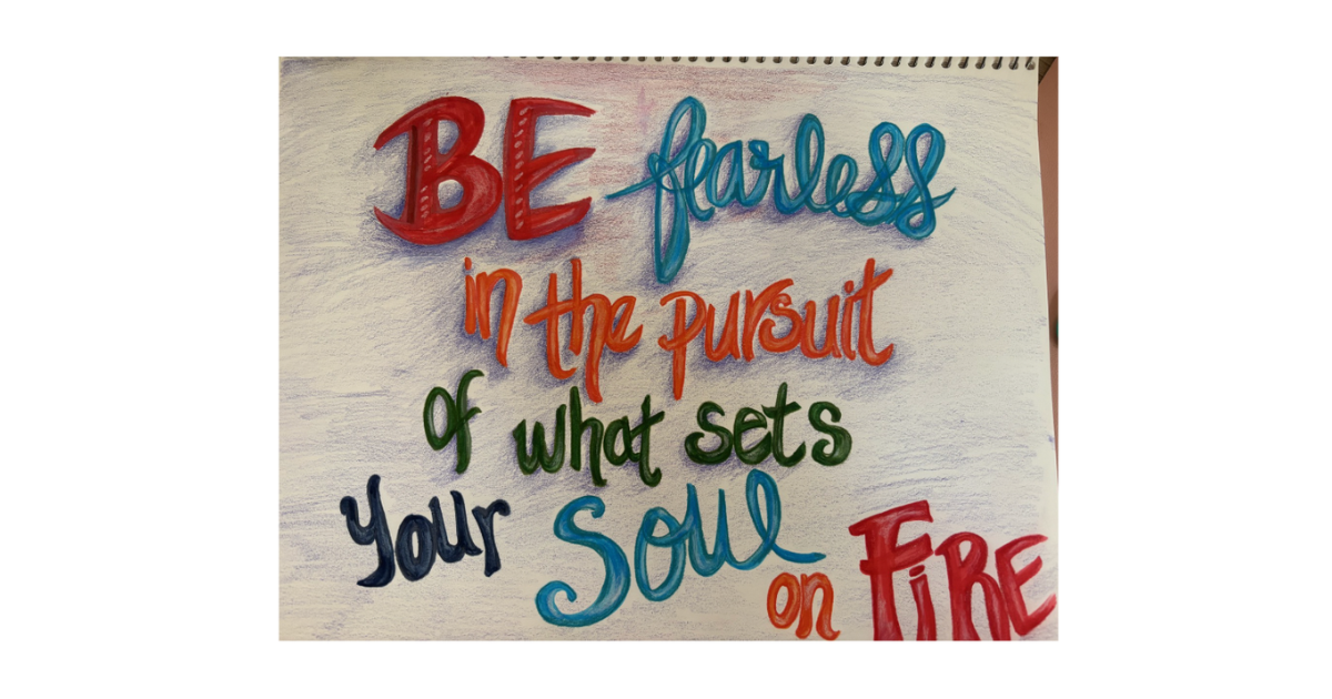 Hand-lettered notebook page reading Be Fearless in the pursuit of what sets your Soul on Fire in multiple colors and styles
